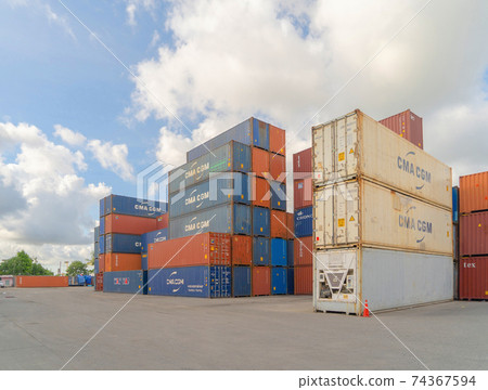 Shipping container site loading by crane in logistic port warehouse storage factory manufacturing business transportation import and export goods of freight business carrier. Shipping container site loading by crane in logistic port warehouse storage factory manufacturing business transportation import and export goods of freight business carrier. 74367594