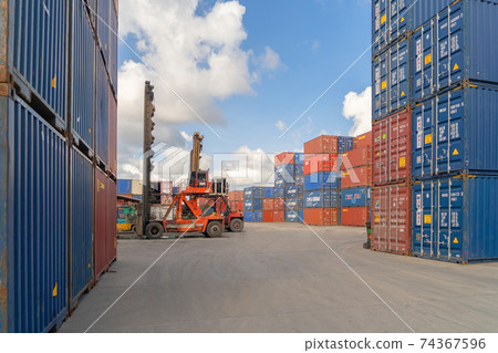 Shipping container site loading by crane in logistic port warehouse storage factory manufacturing business transportation import and export goods of freight business carrier. Shipping container site loading by crane in logistic port warehouse storage factory manufacturing business transportation import and export goods of freight business carrier. 74367596