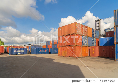 Shipping container site loading by crane in logistic port warehouse storage factory manufacturing business transportation import and export goods of freight business carrier. Shipping container site loading by crane in logistic port warehouse storage factory manufacturing business transportation import and export goods of freight business carrier. 74367598