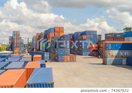 Shipping container site loading by crane in logistic port warehouse storage factory manufacturing business transportation import and export goods of freight business carrier. 74367622