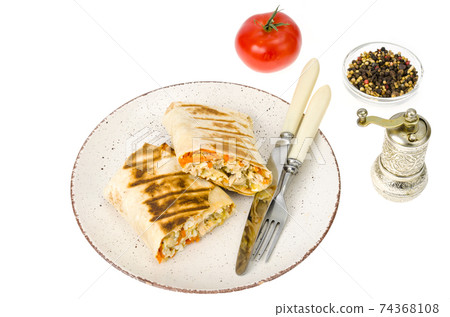 Shawarma, pita, tortilla with chicken and spicy carrots. 74368108