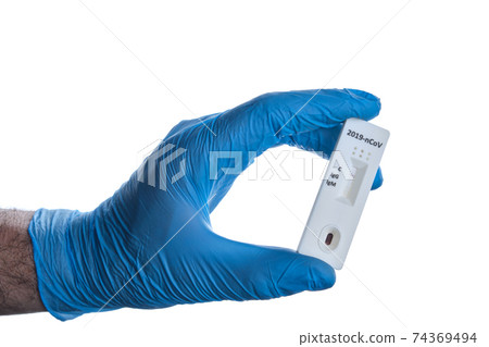 Doctor shows rapid laboratory COVID-19 test for detection of IgM and IgG antibodies to Novel Coronavirus, worldwide pandemics concept. Doctor shows rapid laboratory COVID-19 test for detection of IgM and IgG antibodies to Novel Coronavirus, worldwide pandemics concept. 74369494