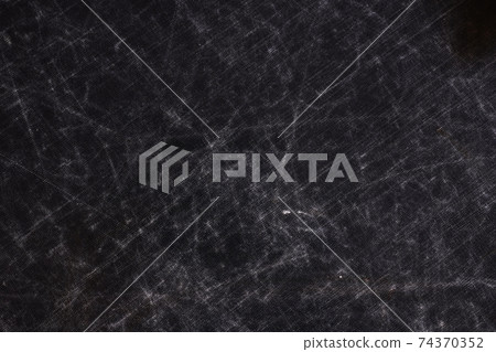 The texture of scratches on fabric on a black background The texture of scratches on fabric on a black background 74370352