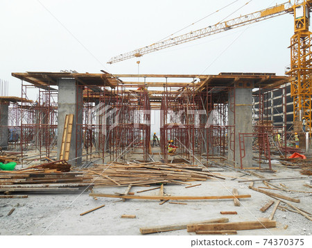 SELANGOR, MALAYSIA -APRIL 17, 2017: Casted concrete column at the construction site. Provided protruding reinforcement bar and ready for next concreting work. Under construction. SELANGOR, MALAYSIA -APRIL 17, 2017: Casted concrete column at the construction site. Provided protruding reinforcement bar and ready for next concreting work. Under construction. 74370375