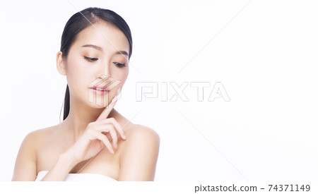 Beauty, cosmetics, healthy, treatment, skincare and spa concept. Asian young woman touching own face Beauty, cosmetics, healthy, treatment, skincare and spa concept. Asian young woman touching own face 74371149