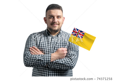 White guy holding a flag of Niue smiling confident with crossed arms isolated on a white background White guy holding a flag of Niue smiling confident with crossed arms isolated on a white background 74371258