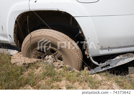 SUV got stuck in the mud, wheel closeup SUV got stuck in the mud, wheel closeup 74373642