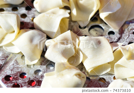 Chinese snack food wonton on steel pan Chinese snack food wonton on steel pan 74373810