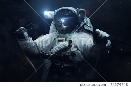Astronaut. Science fiction space wallpaper, incredibly beautiful planets, galaxies, dark and cold beauty of endless universe. Elements of this image furnished by NASA Astronaut. Science fiction space wallpaper, incredibly beautiful planets, galaxies, dark and cold beauty of endless universe. Elements of this image furnished by NASA 74374748
