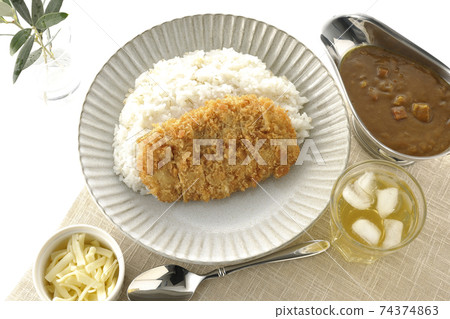 Curry pot with rice with pork cutlet and roux, cheese topping, tea and olive leaves (overhead view) Curry pot with rice with pork cutlet and roux, cheese topping, tea and olive leaves (overhead view) 74374863
