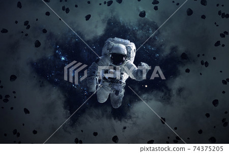 Science fiction space wallpaper with astronaut, incredibly beautiful planets, galaxies, dark and cold beauty of endless universe. Elements of this image furnished by NASA 74375205