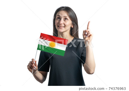 Happy young white woman holding flag of Kurdistan and points thumbs up isolated on a white background Happy young white woman holding flag of Kurdistan and points thumbs up isolated on a white background 74376963