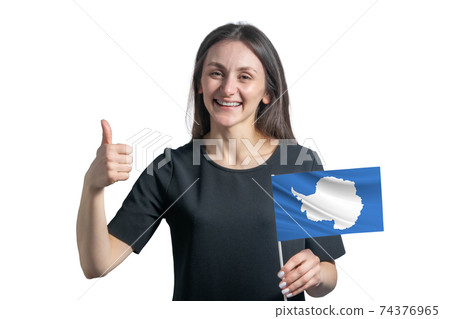 Happy young white woman holding flag of Antarctica and shows the class by hand isolated on a white background Happy young white woman holding flag of Antarctica and shows the class by hand isolated on a white background 74376965