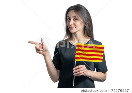 Happy young white woman holding flag Catalonia and points to the left isolated on a white background Happy young white woman holding flag Catalonia and points to the left isolated on a white background 74376967