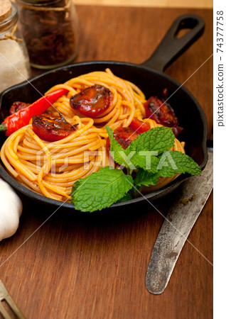 italian spaghetti pasta and tomato with mint leaves italian spaghetti pasta and tomato with mint leaves 74377758