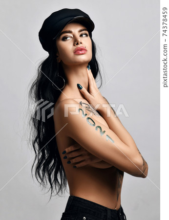 Portrait of naked brunette woman with pouty lips Portrait of naked brunette woman with pouty lips 74378459
