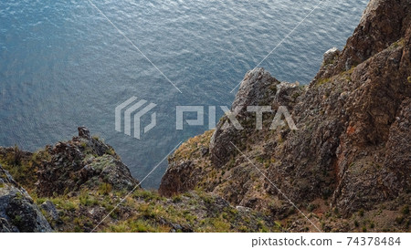 Rocky shore high above the water Nature photography 74378484