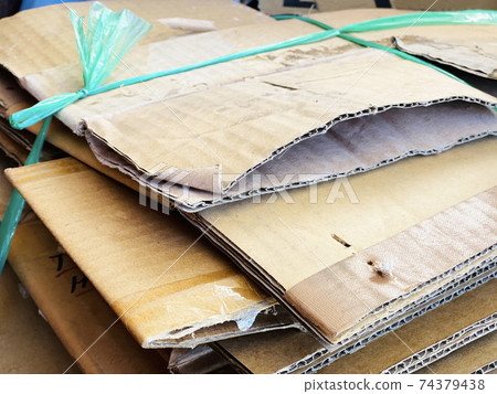 Garbage bundled with cardboard Garbage bundled with cardboard 74379438