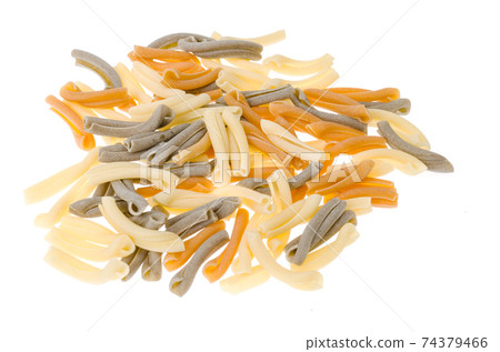 Pile of multi-colored pasta isolated on white background. Pile of multi-colored pasta isolated on white background. 74379466
