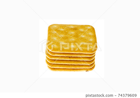 Delicious golden salt cracker cookies isolated on white background. 74379609