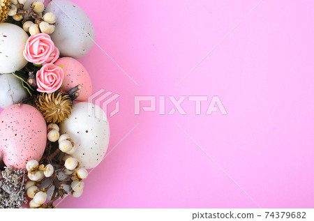 Easter wreath of colorful decorative eggs, flowers Easter wreath of colorful decorative eggs, flowers 74379682