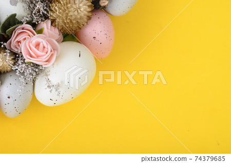 Easter wreath of colorful decorative eggs, flowers Easter wreath of colorful decorative eggs, flowers 74379685