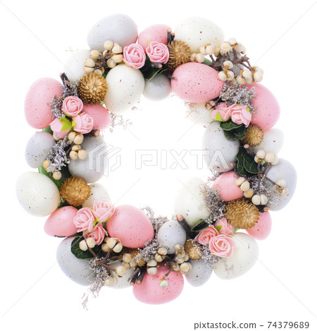 Easter wreath of colorful decorative eggs, flowers Easter wreath of colorful decorative eggs, flowers 74379689