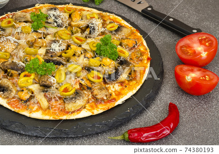 Pizza with mussels, mushrooms, green olives Pizza with mussels, mushrooms, green olives 74380193