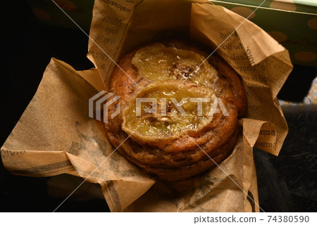 Banana cake wrapped in paper. Banana cake wrapped in paper. 74380590