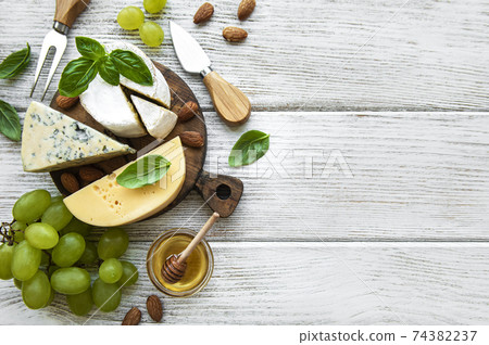 Different types of cheese with snacks Different types of cheese with snacks 74382237