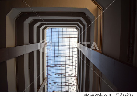 Abstract geometry perspective inside of a building. Geometric pattern architecture. The geometry of the interior of the hotel 74382583