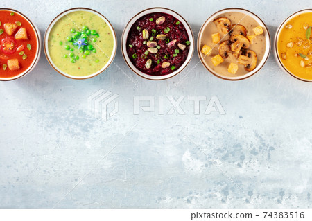 Vegan soups background with a place for text. Various cream soups Vegan soups background with a place for text. Various cream soups 74383516
