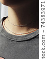 Tender jewerly on female neck, close up shot 74383971