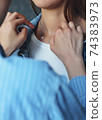 Tender jewerly on female neck, close up shot 74383973
