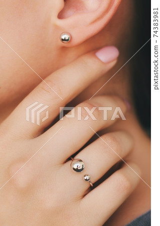 Tender jewerly on female hand, close up shot Tender jewerly on female hand, close up shot 74383981
