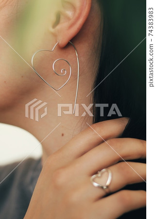Tender jewerly for female ears, close up shot Tender jewerly for female ears, close up shot 74383983