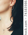 Tender jewerly for female ears, close up shot 74383986