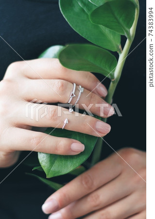 Tender jewerly on female hand, close up shot Tender jewerly on female hand, close up shot 74383994