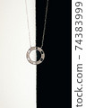 Tender jewerly for female neck, close up shot 74383999