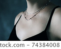 Tender jewerly on female neck, close up shot 74384008