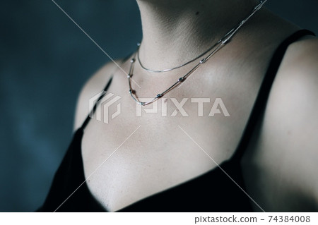 Tender jewerly on female neck, close up shot 74384008