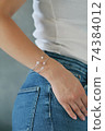 Tender jewerly on female hand, close up shot 74384012