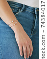 Tender jewerly on female hand, close up shot 74384017