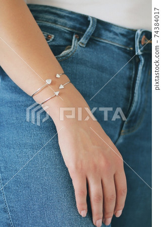 Tender jewerly on female hand, close up shot Tender jewerly on female hand, close up shot 74384017