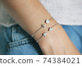 Tender jewerly on female hand, close up shot 74384021
