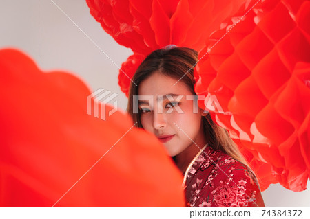 Asian beautiful woman wearing traditional cheongsam qipao dress take photography and chinese lantern 74384372