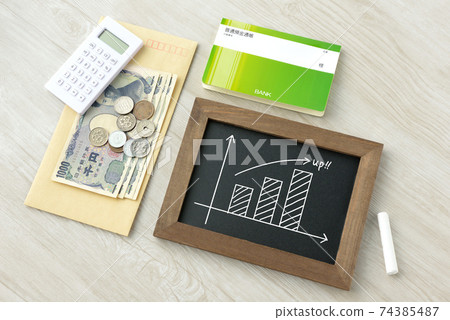 Graph of money and uptrend 74385487