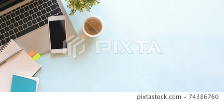 Simple Top view table - Creative flat lay office desk. Laptop, notebooks and coffee cup on white background. Panorama banner blue background with copy space. Simple Top view table - Creative flat lay office desk. Laptop, notebooks and coffee cup on white background. Panorama banner blue background with copy space. 74386760
