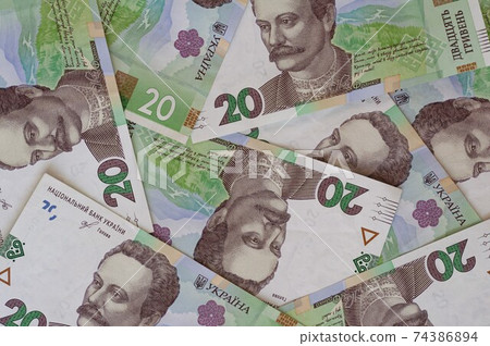 Paper money, Ukrainian hryvnia in denomination 20 hryvnia, new money, background with scattered banknotes 74386894