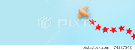 The red star is the symbol of the army. The plane is carrying a star. February 23 concept The red star is the symbol of the army. The plane is carrying a star. February 23 concept 74387548